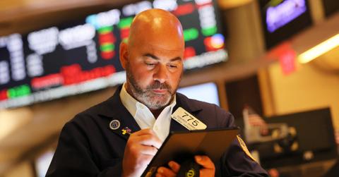 A stock trader looking at data