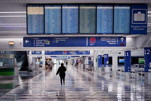 A woman walking through an airport