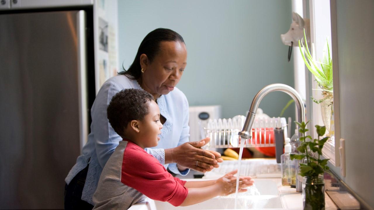 Woman and child doing household chores