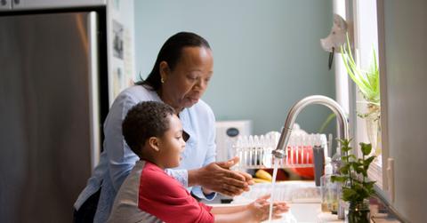 Woman and child doing household chores