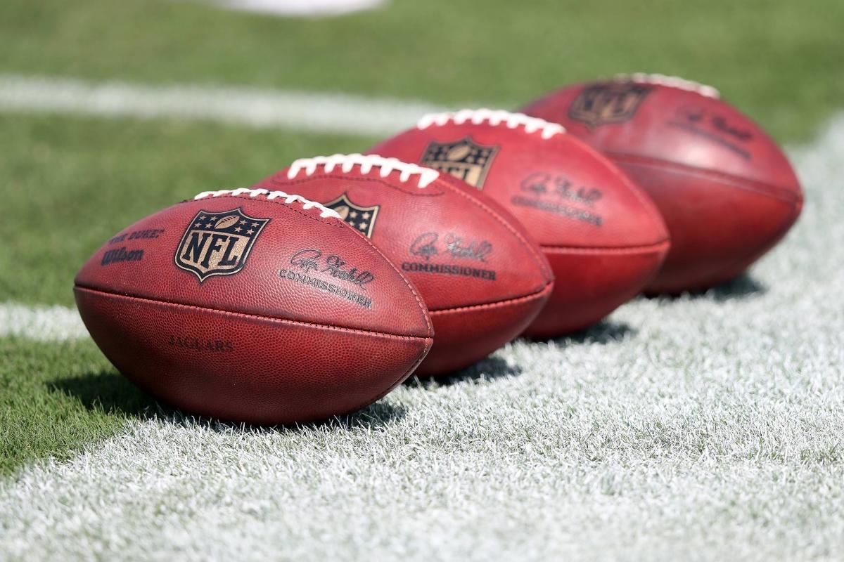 NFL footballs on a field