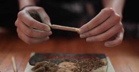 Person rolling marijuana