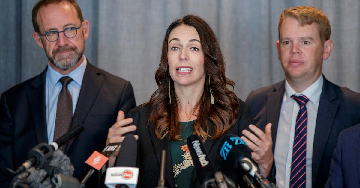 New Zealand Prime Minister Jacinda Ardern (center) speaking at press conference