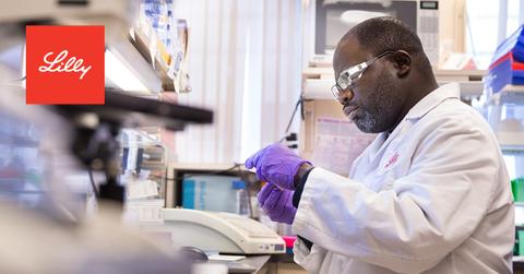 Eli Lilly scientist and logo