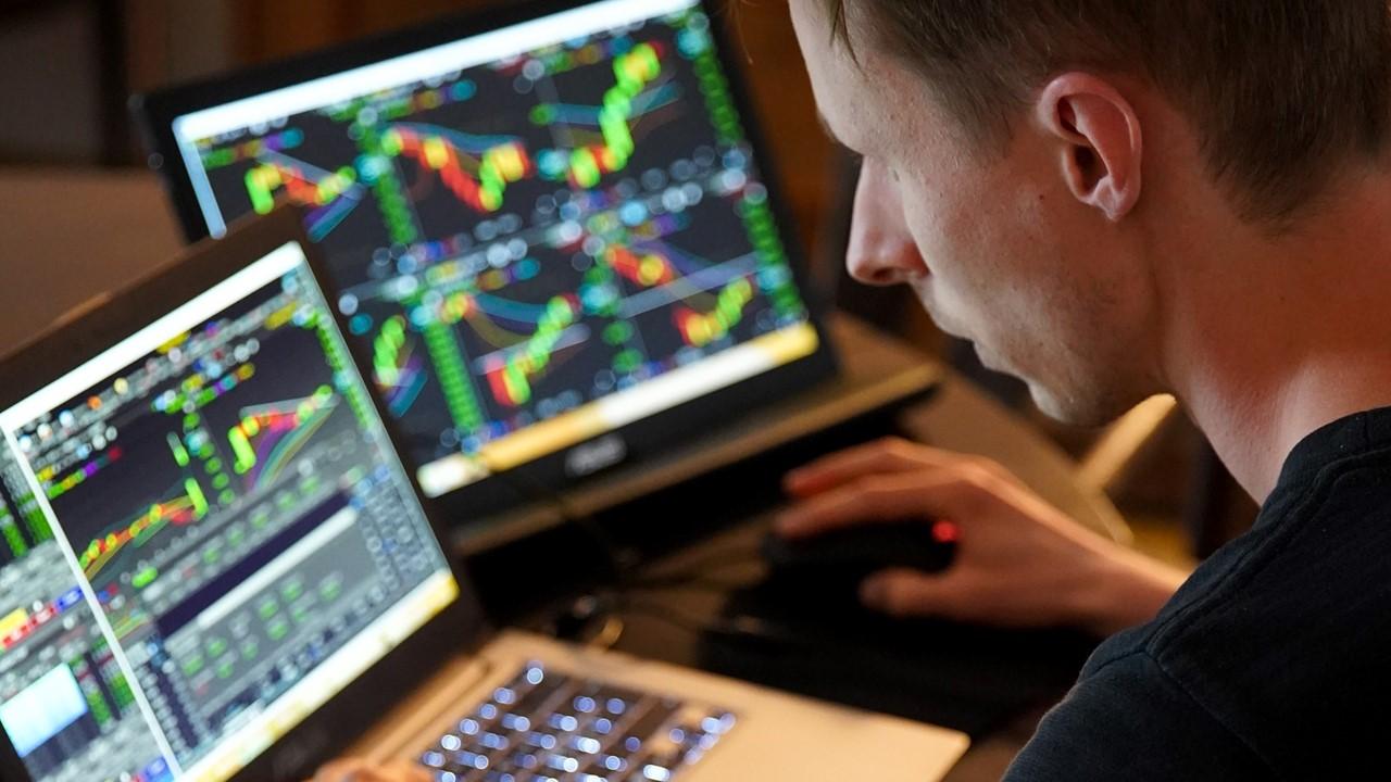 Person viewing stock prices on computer