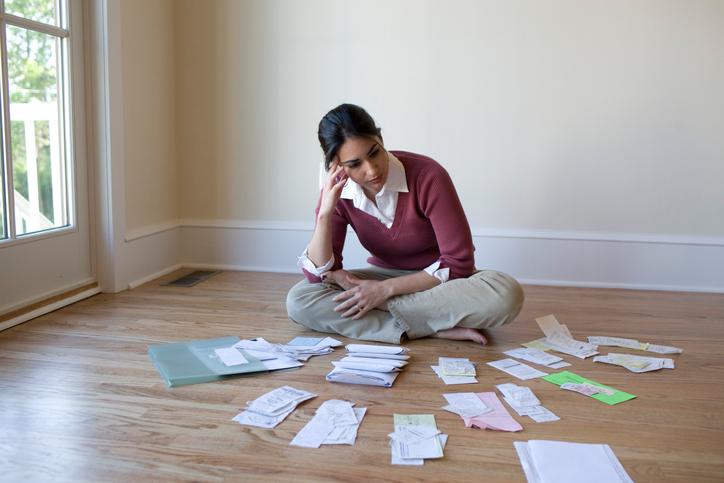 A woman looking at her bills 