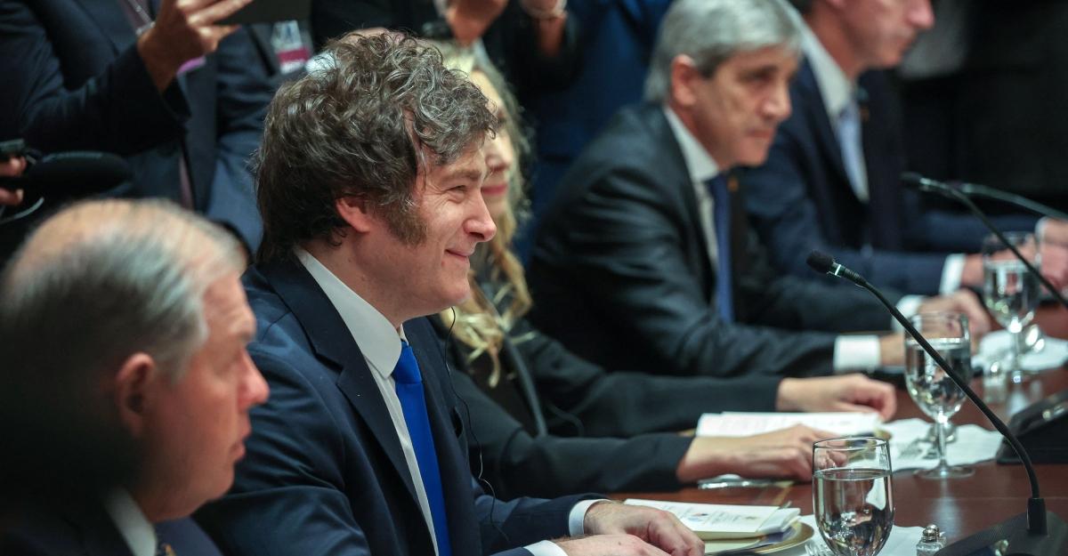 Javier milei smiles while meeting with trump