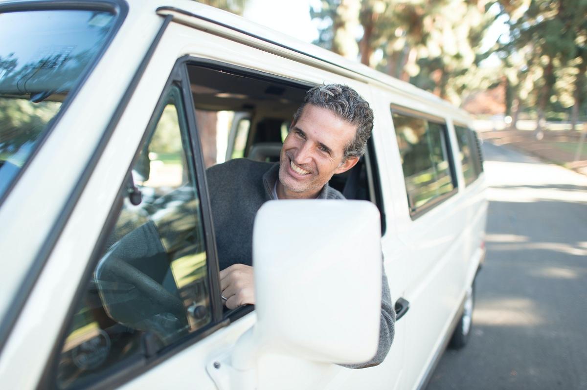 A man driving a van