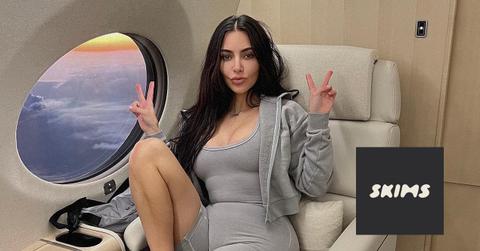 Kim Kardashian wearing Skims shapewear and Skims logo