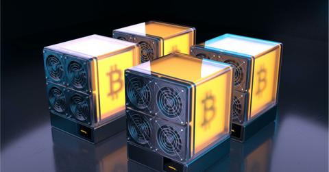 The Bitcoin logo displayed on four illustrated mechanical cubes