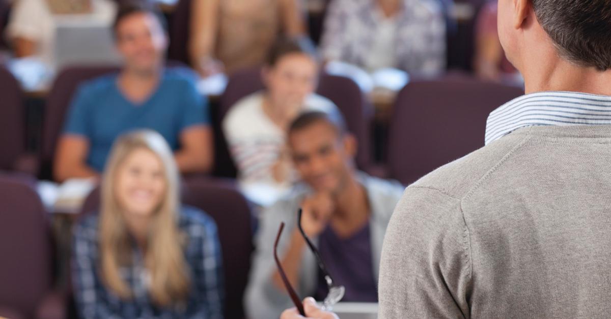 College professor teaching students.