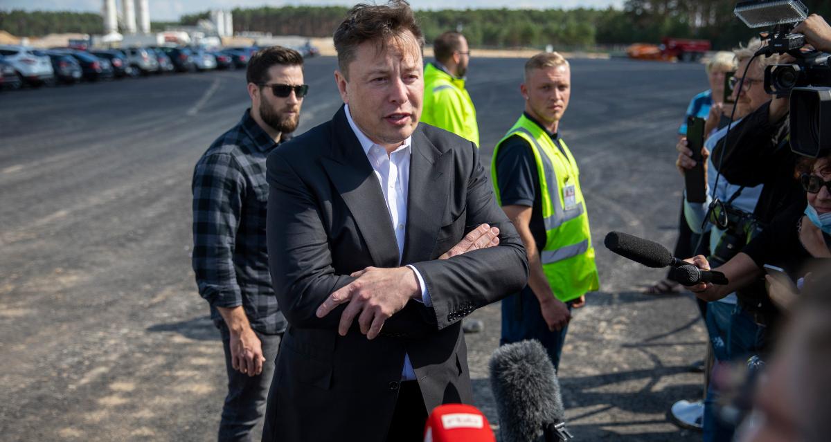 Tesla CEO Elon Musk speaking with journalists