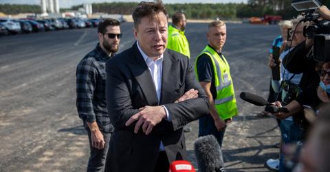 Tesla CEO Elon Musk speaking with journalists