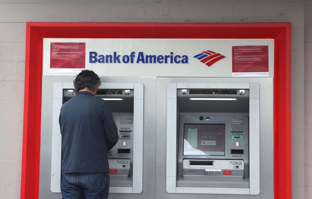 A person using a Bank of America ATM