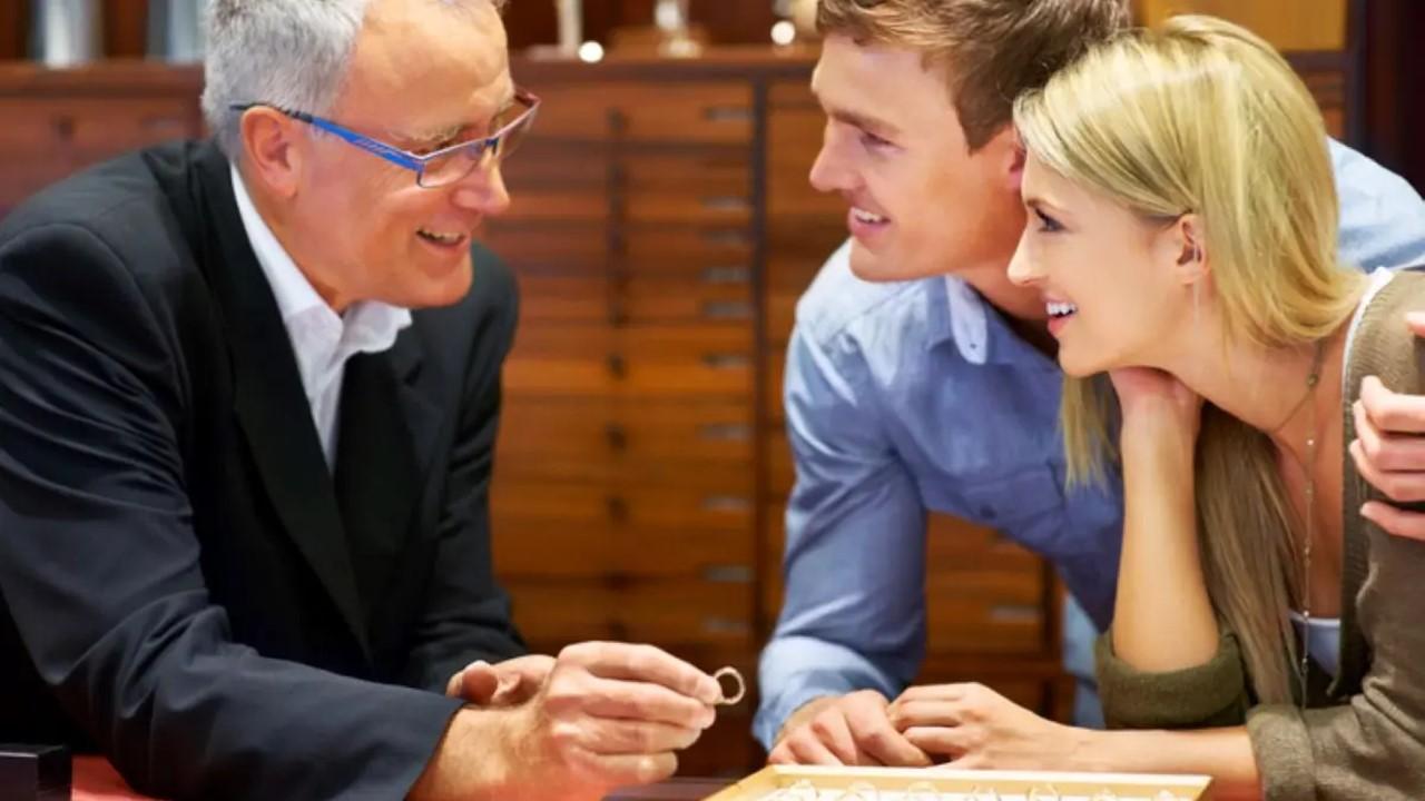 A man and woman shopping for an engagement ring