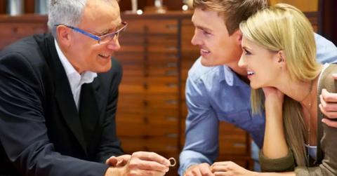 A man and woman shopping for an engagement ring