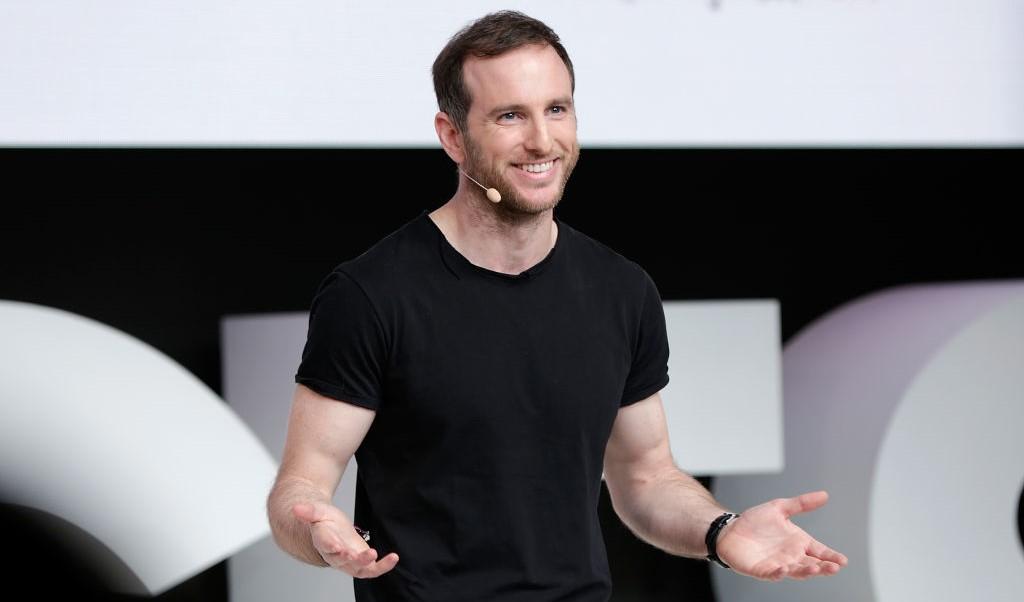 airbnb co-founder joe gebbia speaking on stage