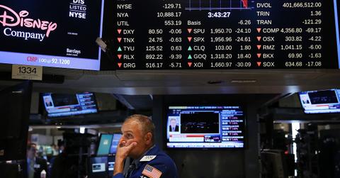 Trader looks at quotes as stocks crash