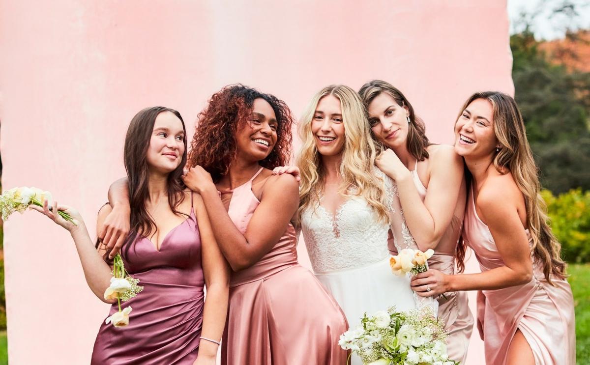 A bride with four bridesmaids in dresses from David's Bridal