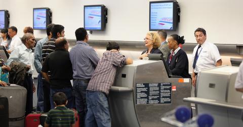 Customers waiting at airline counter