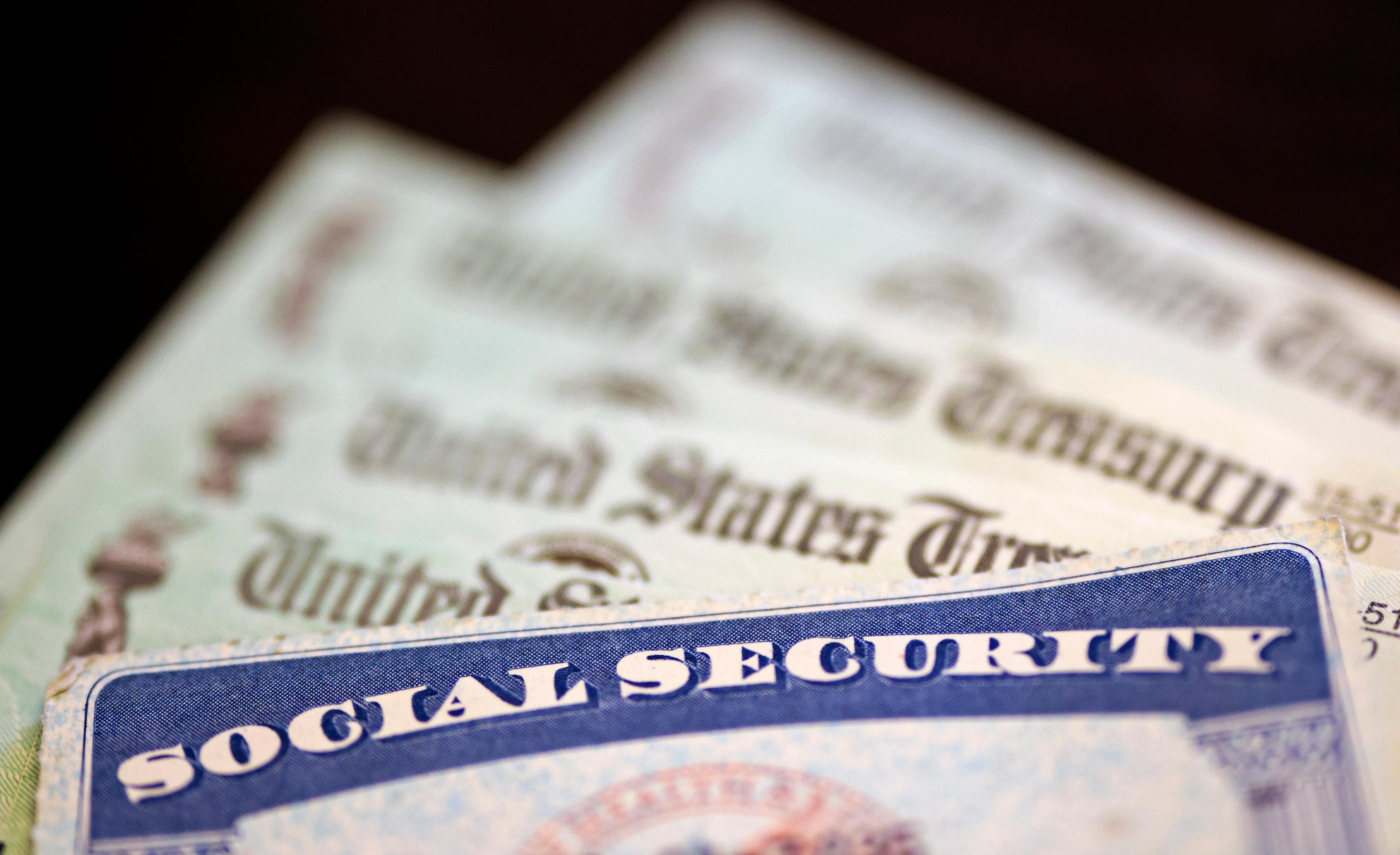 Social security card over us treasury check
