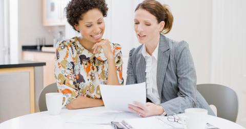 Financial adviser helping woman plan for retirement