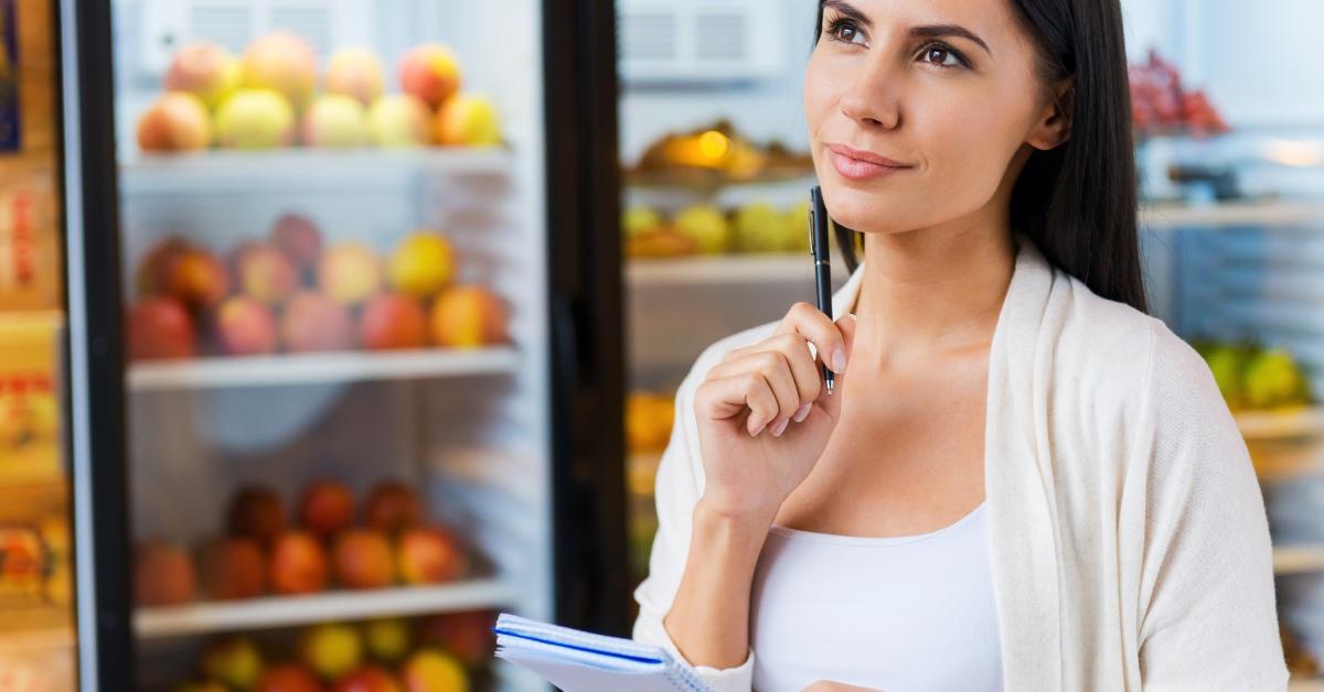 A woman shopping for cheap vegan food.