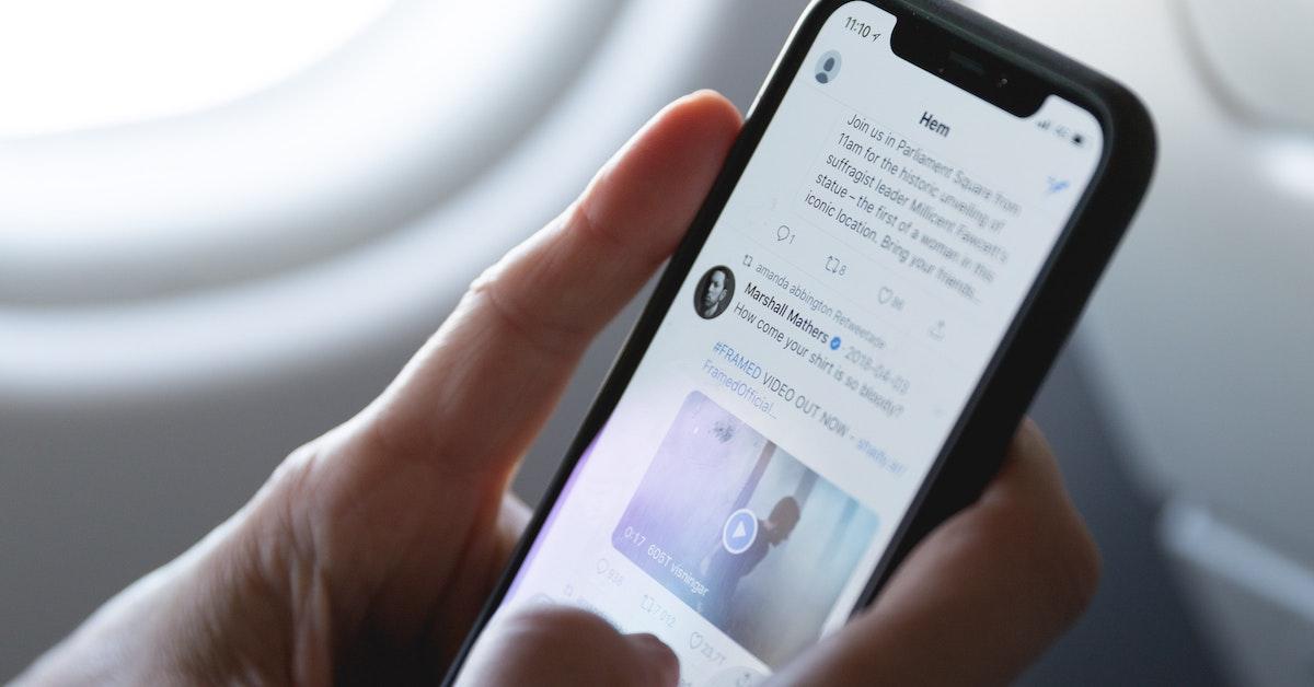 Person views Twitter app on their phone.