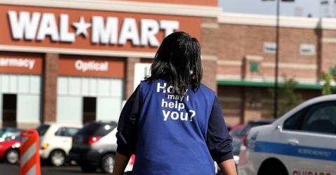 Walmart employee walking in a parking lot