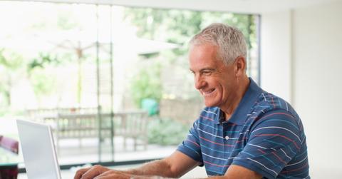 A man using a laptop for zero-based budgeting