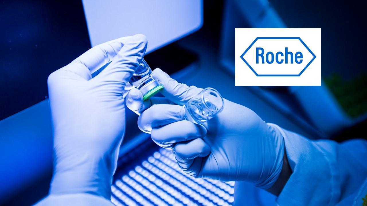 Person holding medical vials and Roche logo