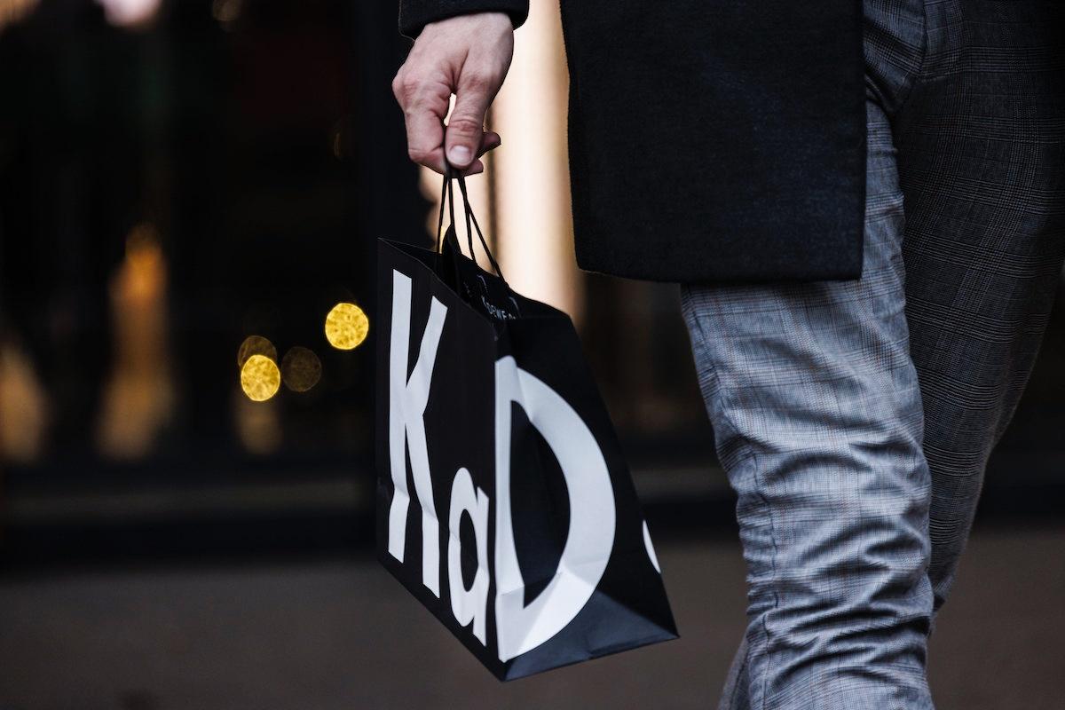 A person holding a shopping bag