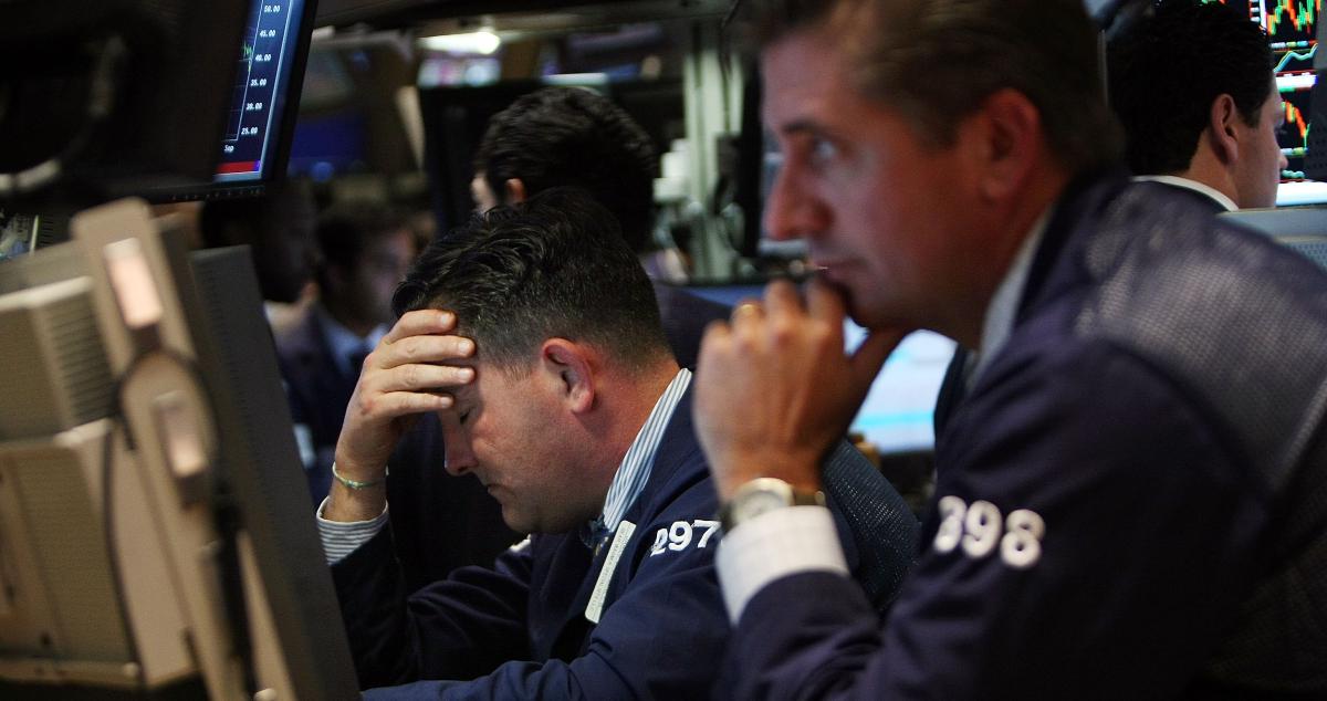 Worried traders look at falling stock prices