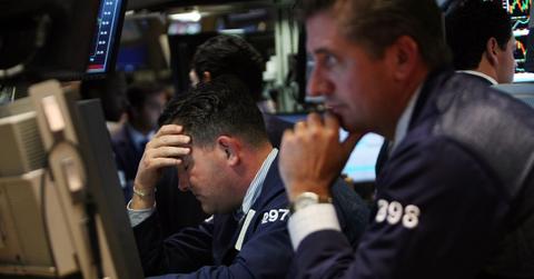 Worried traders look at falling stock prices