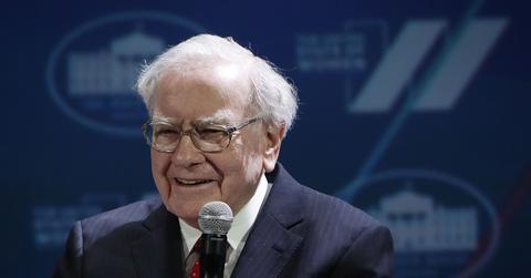 Warren Buffett speaking into microphone