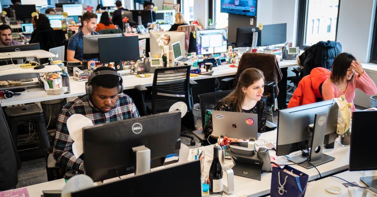 Members of the 'BuzzFeed News' team work at their desks at BuzzFeed headquarters.