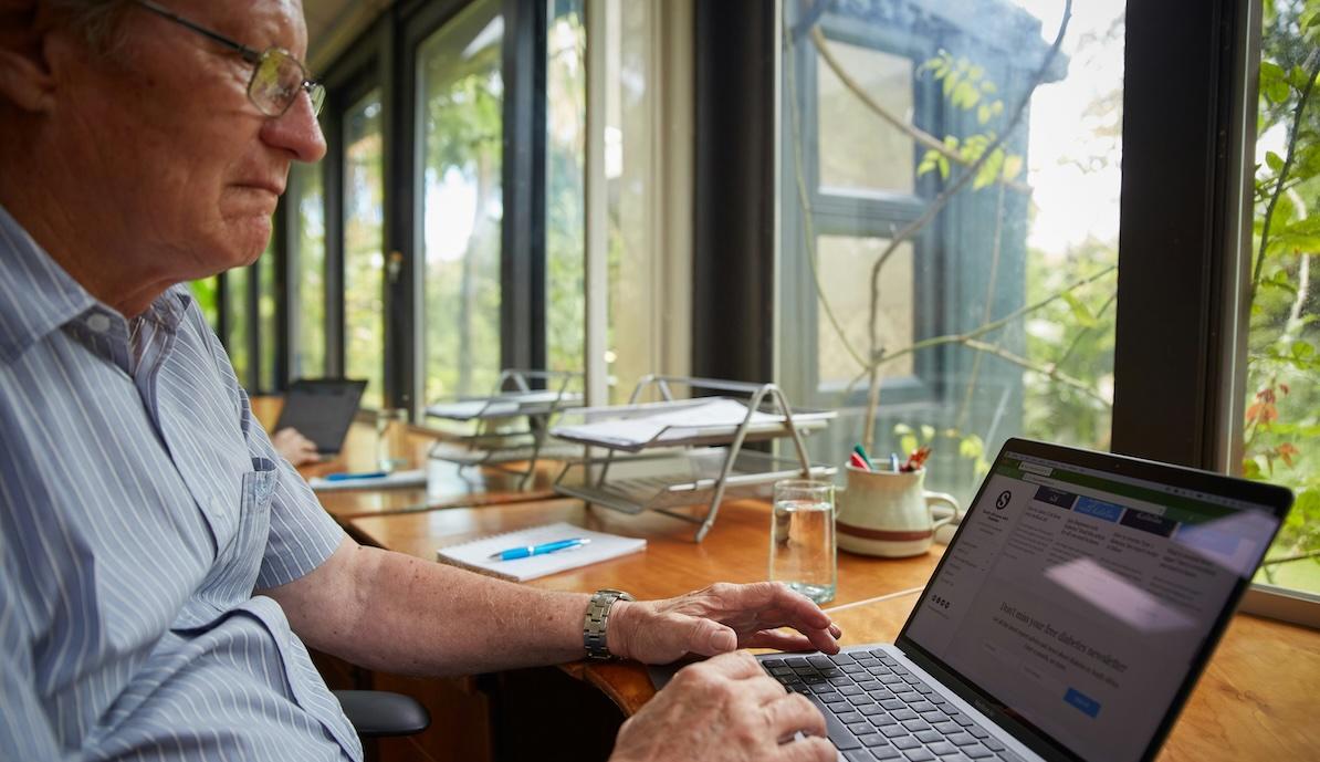 older man on computer