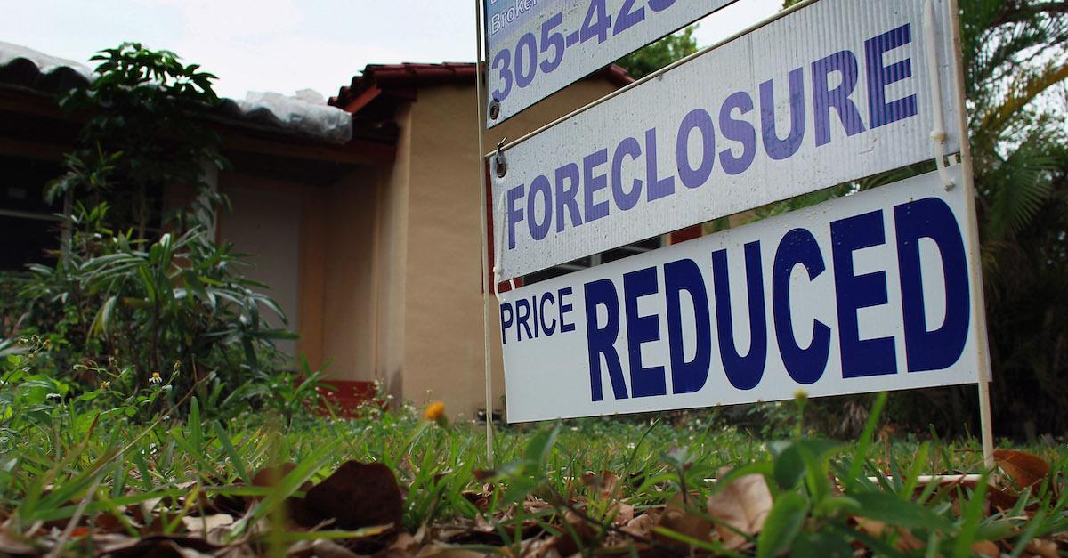 A foreclosure sign in front of a home
