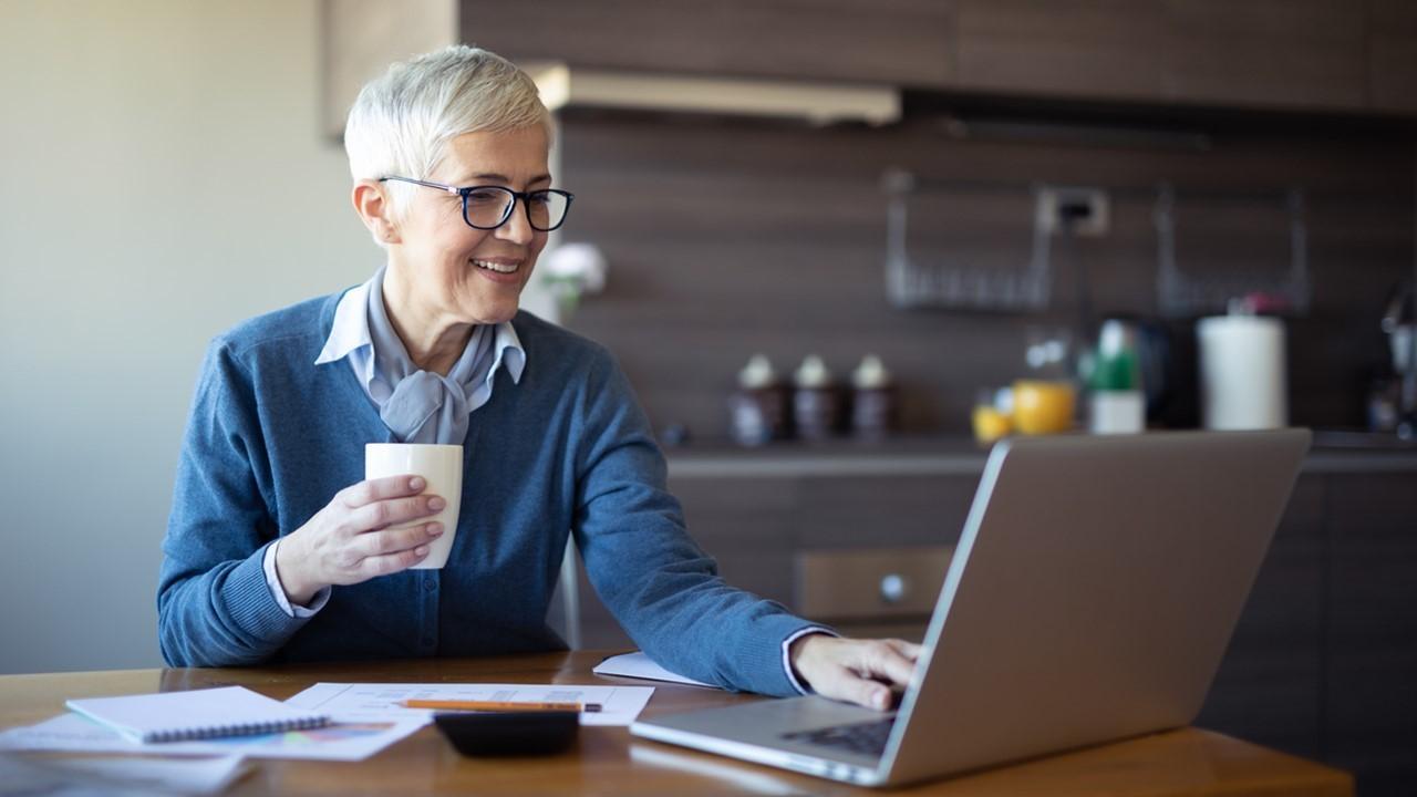 Woman looking at spousal benefits on a laptop