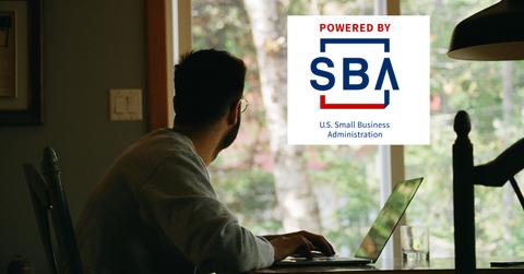SBA logo over independent contractor working from home