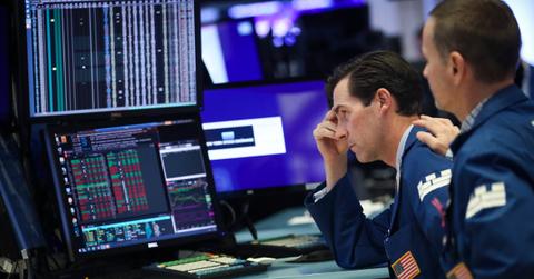 Worried trader looks on as stocks fall
