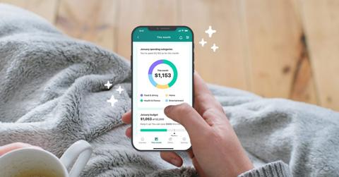 A woman using a budgeting app