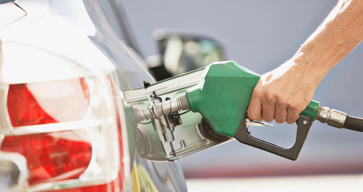 man pumping gas