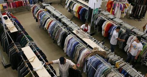 A man thrift shopping at a store.