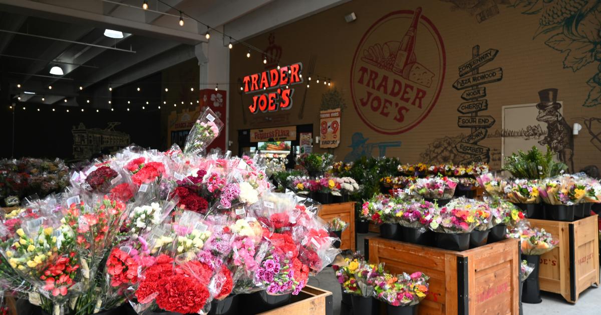Flowers on display outside of a Trader Joe's store.
