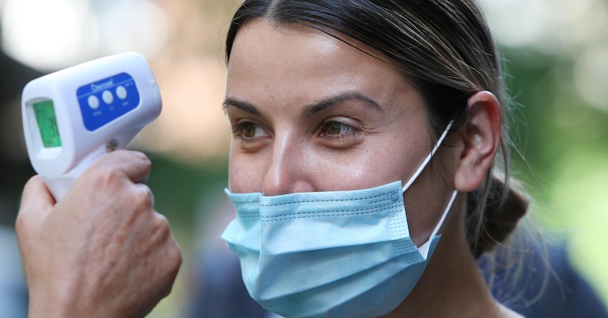 healthcare worker gives fever check