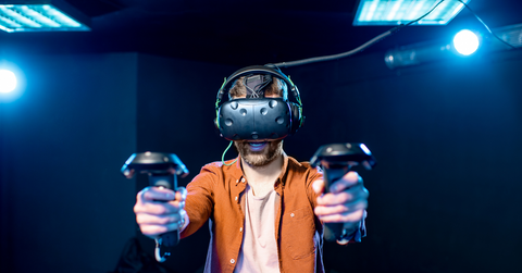 A man using a VR headset to access the metaverse