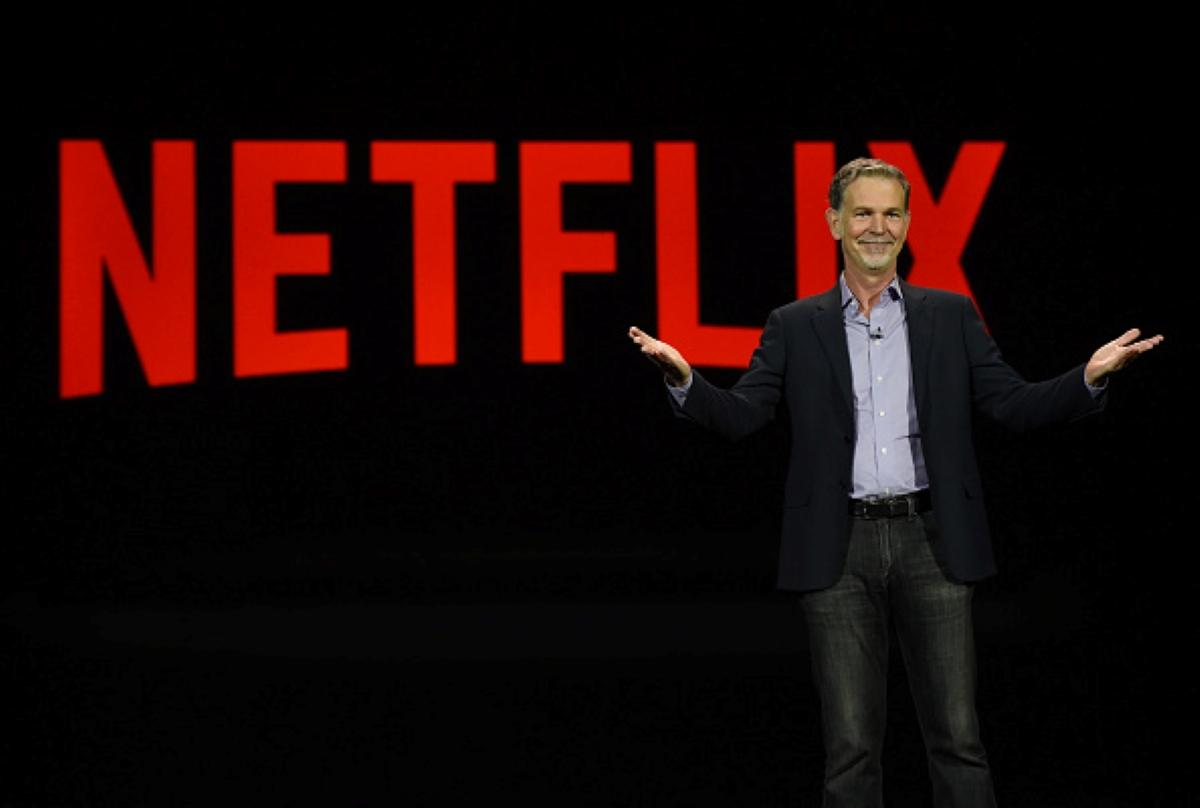 Netflix sign and CEO Reed Hastings