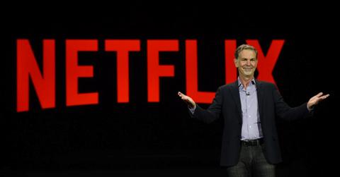 Netflix sign and CEO Reed Hastings