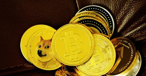 A pile of cryptocurrency coins on a leather sofa